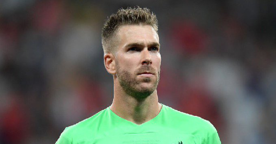 Liverpool goalkeeper Adrian harmed by a fan on the pitch