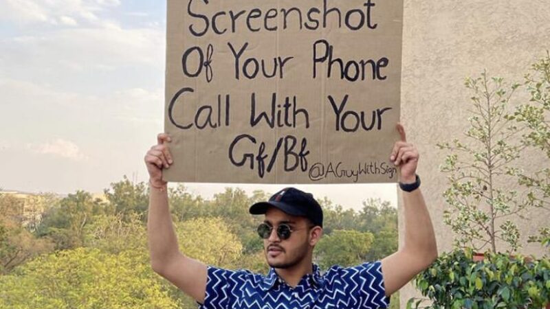 A GUY WITH SIGN Making Best Utilization Of Social Resources To Convey His Message To The World