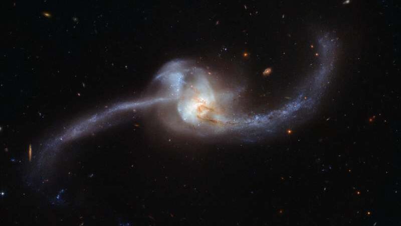 The two galaxies orbited together in a cosmic collision captured by Hubble