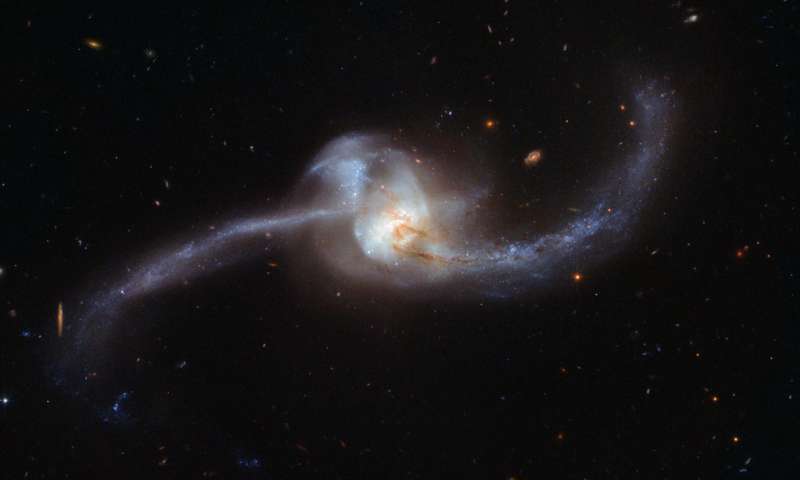 The two galaxies orbited together in a cosmic collision captured by Hubble