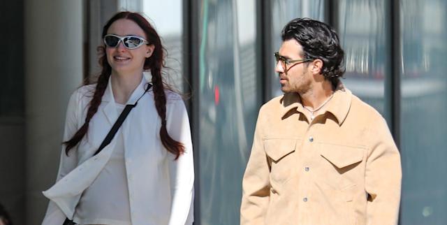 Sophie Turner with Baby Jump at the All-White Ensemble with Joe Jonas