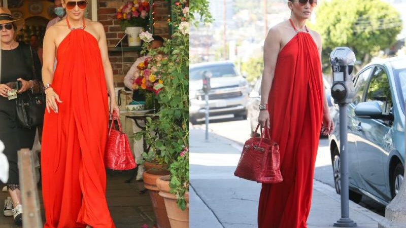 In a matching Hermes Birkin bag and a red maxi dress, Jennifer Lopez looks effortless