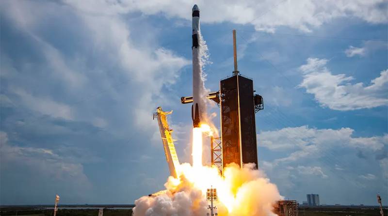 SpaceX launches a Falcon 9 booster on a record-breaking eighteenth flight from Cape Canaveral